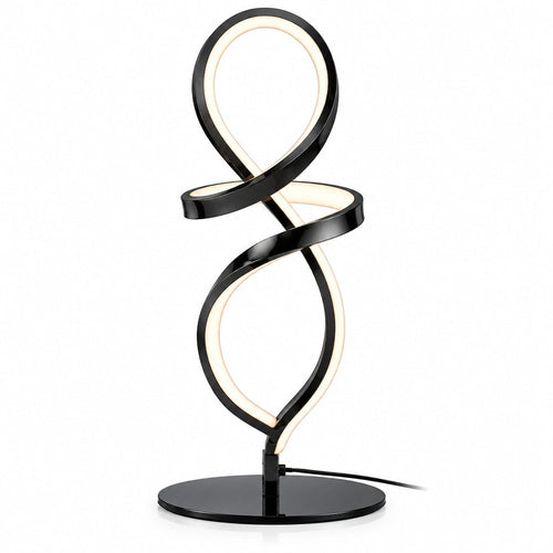 Modern black spiral table lamp on a desk with a plant and books in the background