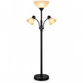 Black floor lamp with multiple light heads on a white background